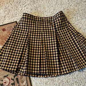 ADORABLE school girl mini skirt. Elastic waistband. V comfy. Zipper up side.